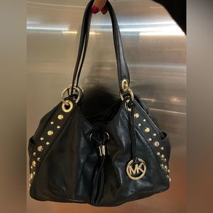 Super soft and slouchy Michael Kors gold studded handbag